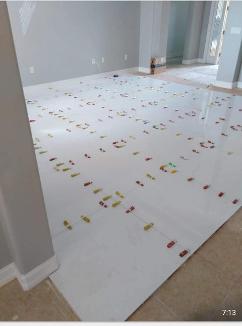 Ultra Thin 0.5mm Tile Leveling System With 2000 Spacers For Floor And Wall Installations in use on white floor tiles