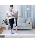 Mobile Height Adjustable Standing Desk With Sturdy Silent Rolling Casters And Flexible Tray Surface used in home office.