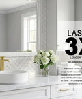 Gold Vessel Sink Faucet in Brushed Gold Finish on white countertop with round sink and flowers in modern bathroom
