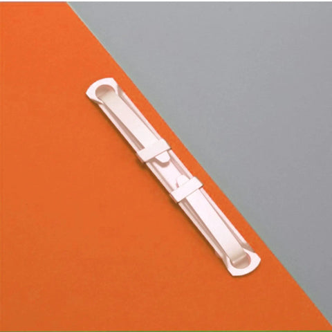 Heavy Duty Tempered Steel Prong Paper Fastener Bases 100 Pack Fits Standard Two Hole Punches Built Damn Tough lying on colored paper.