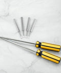 Two yellow-handled magnetic screwdrivers with four interchangeable bits on marble surface