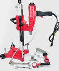 Front view of red BLUEROCK 4Z1RB core drill on rolling base with diamond bit set and wrenches.