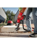 Top Shelf Brushless M18 Rotary Hammer With D Handle And Sds Plus Chuck in use drilling concrete on a construction site.