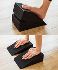 High Grade Foam Yoga Wedge Blocks Set Of Two With Carry Bag shown in use for stretching and balance support on hardwood floor.