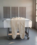 Canvas Sandblasting Suit With Hood Full Body Dustproof Workwear For Grinding And Sanding In Factory Workshops Hardcore Protection And Comfortable Fit Durable Grit Proof Coverall For Maintenance Jobs, beige canvas coverall on table
