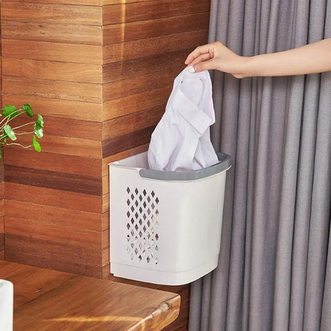 Person using Removable Laundry Basket With Sturdy Storage Rack On Wheels White Household Organizer For Laundry And Home Storage