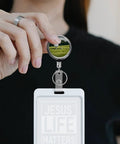 Heavy Duty Metal Badge Reel With 360 Degree Swivel And Secure Belt Clip, showcasing a retractable ID holder in use.