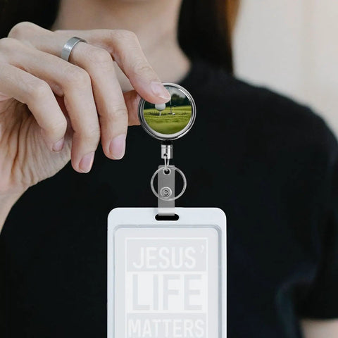 Heavy Duty Metal Badge Reel With 360 Degree Swivel And Secure Belt Clip, showcasing a retractable ID holder in use.