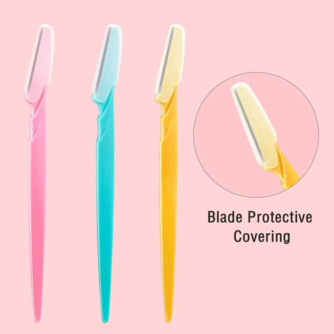 Top Shelf Dermaplane Razor Blade Refills For Ultra Smooth Face Shaving And Gentle Exfoliation With Durable Stainless Steel Eyebrow Shapers in pink, blue, and yellow with blade covers.