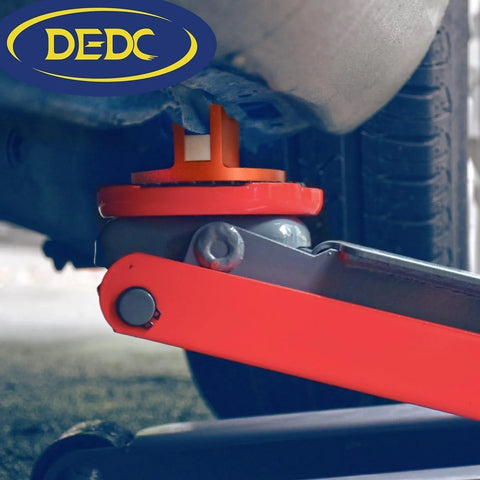 DEDC aluminum grooved jack pad installed under vehicle frame for lifting (orange)