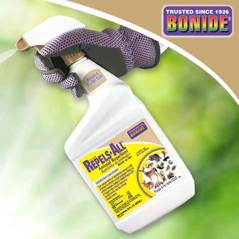 Repels All Animal Repellent Ready To Use Spray 32 Oz outdoor yard garden pest barrier bottle held in gloved hand
