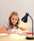 Girl studying at desk with Metal Desk Lamp With Dope Wireless Charging Pad And USB Port 3 Way Dimmable Arc Bedside Light Touch Control.