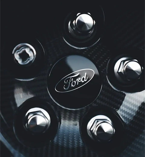 Close-up of Ford wheel with M12x1.50 Chrome Wheel Lug Stud Nut Set For Ford Focus Fusion Fiesta Escape EcoSport Ranger MKC MKZ And More