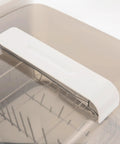 Portable Countertop Mini Dishwasher With 360 Degree Rotating Spray Heads And 1.59 Gallon Tank top view of white lid and interior features.