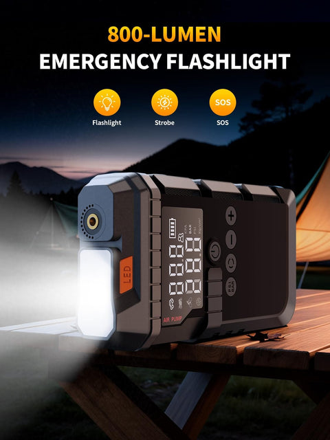 Portable Jump Starter With Air Compressor 6000A Peak 12V Jump Box 160 PSI Tire Inflator LED Display shining on campsite table