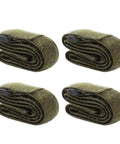 Four Pack Premium Travel Luggage Tie Down Straps are rolled green polyester straps for securing cargo while traveling.