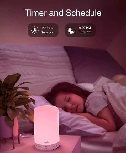 Child sleeping peacefully in bed with a Smart LED Bedside Lamp With App Control, Voice Assist, and RGB Color Changing Mood Light glowing pink.