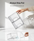 Hand holding Compact Clear Stackable Storage Drawers Four Pack Super Sleek Plastic Organizer Bins for narrow spaces.