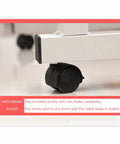Close-up of the lockable brake pulley on the Adjustable Height Rolling Overbed Table With Easy Glide Casters for stability.