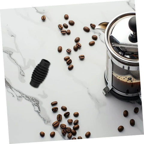 Heat Insulation Pad Rubber Sleeve For Espresso Steam Wand Burn Protection next to coffee beans and French press on marble surface
