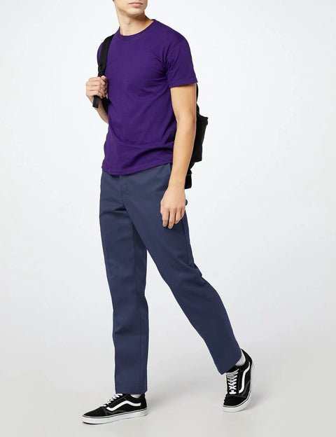 Original Straight Leg Work Pants Built Solid As A Rock With The Roomy Big And Tall Fit Stone Cold Durable Polyester Cotton Blend Resists Wrinkles And Grease Spills Perfect For The Job Site Or Daily Office Hustle Navy Shade worn with a purple t-shirt.
