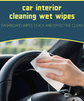 Car interior cleaning wipes in use on steering wheel; hand holds white disposable cleaning cloth.