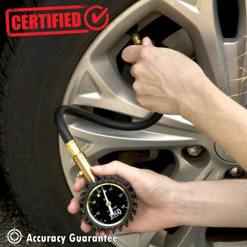 JACO ElitePro Tire Pressure Gauge 60 PSI, close-up of handheld black dial gauge with hose at car tire valve