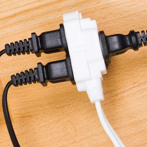 Three Outlet Extension Cord 15 Ft Power Strip 2 Pack White UL Listed with cables plugged on wooden surface