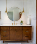 Modern bathroom vanity with round mirror, featuring Antique Brass Cabinet Knobs Zinc Alloy 6 Pack Vintage Drawer Knobs And Pulls.