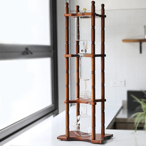 Generous Eighty Four Oz Cold Brew Drip Tower Iced Coffee Maker With Hand Blown Glass Vessel And Solid Wood Base displayed in kitchen
