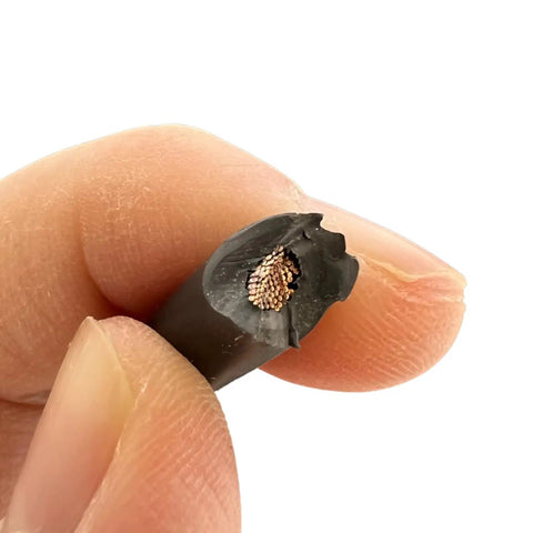 Close-up of Top Shelf Heavy Duty DC PV Cable 100 FT Roll 10 AWG showing tinned copper core, ideal for solar panel systems.