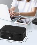 Travel Jewelry Case With PU Leather Exterior And Velvet Lining Portable on table next to laptop and tablet, size 6.3x4.3x2.2 inches.
