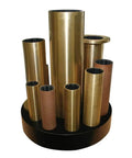 Brass marine shaft bearings displayed vertically; includes Water Lubricated Aqualube Brass Bearing For Marine Shafts Three And One Quarter Inch Inner Diameter Four And One Quarter Inch Outer Diameter Thirteen Inch Length Hydrodynamic Water Film For Smooth Slow Speed Performance Part Number 674N 1958.