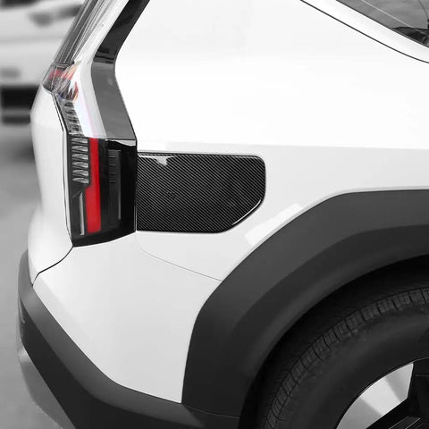 Premium ABS EV Charging Port Cover Trim For Hyundai Kia EV9 2024 To 2025, carbon fiber pattern, installed on vehicle side.