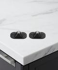 4pcs Small Furniture Adhesive Swivel Caster Wheels mounted on a marble countertop, showcasing easy installation features.