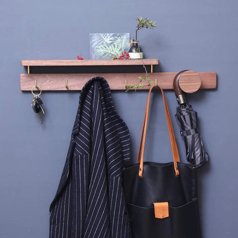 Badass Wall Mounted Coat Rack and Multi Slot Key Hook Solid Wood Construction with Brass Hooks to Hang Coats Jackets Handbags Hats Umbrellas Heavy Duty Build Sweet Entryway Decor featuring a black coat and umbrella.