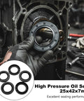 Installed view: five black nitrile high‑pressure oil seals with springs for rotary shafts, 25x42x7 mm.