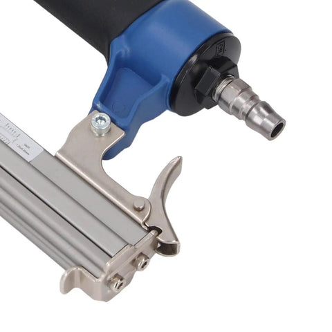Professional Pneumatic Brad Nailer Built Knockout Tough For Woodworking Jobs Holds Up To One Hundred Nails close-up of trigger and air connector.