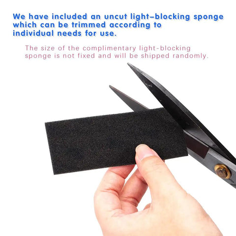 Pre Cut Self Adhesive Light Seal Foam Replacement Kit To Banish Light Leaks On Classic Cameras, uncut black sponge held by scissors.
