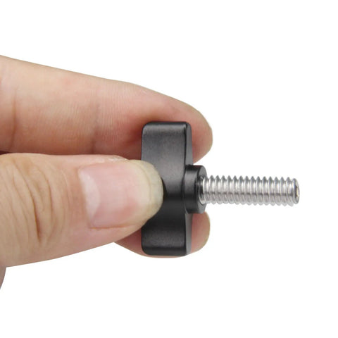 Straight Up Tough Four Pack 1/4x3/4 Inch Thumb Screws With Smooth Turning Matte Black Aluminum Knobs shown being held.