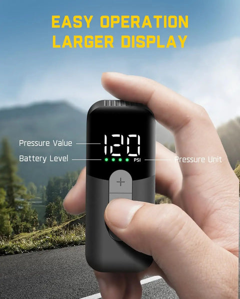 Hand holding Pocket Size Electric Bike Pump With Gauge 120 PSI Auto Stop for Presta and Schrader Valves showing pressure display