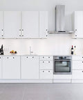 Modern kitchen with white cabinets fitted with Five Pack Acrylic Cabinet Pulls With Five Inch Hole Centers 128mm Modern Black Matte Lucite T Bar Drawer Handles.