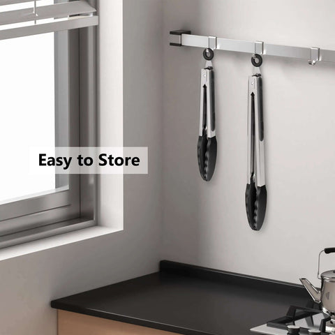 Two Pack Black Kitchen Tongs Set Pro Grade Silicone BPA Free Nonstick Stainless Steel BBQ Grilling Tongs hanging on rack