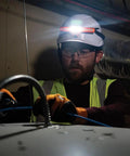 Electrician using Rechargeable LED Wide Beam Headlamp With Hard Hat Mounts For Work, 770 Lumens, Lightweight And Comfortable, in dark