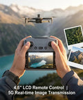 Person holding controller showing 4K GPS Drone With 4.5 Inch HD Controller Screen, Foldable Quadcopter above mountains.
