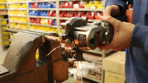 High Power Cordless Rebar Cutter With Battery Included For Easy DIY Metal Cutting And Construction Projects cutting rebar in a vise.