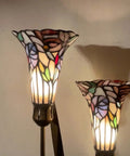 Close-up of Lily Flowers And Dragonfly Tiffany Style Stained Glass Table Lamp with warm multicolor glow, 19 inches tall