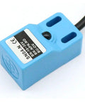 Metal Detection Sensor Proximity Switch For Metal Inspection SN04 N SN04 N2 SN04 P SN04 P2 SN04 D1 D2 Y1 Y2 NPN PNP NC NO blue rectangular sensor with cable