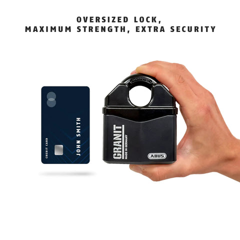 Hand holding Granit 37/80 Beefy Heavy Duty Padlock With Hidden Closed Shackle 14mm Shackle 2 Keys beside credit card for scale.