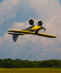 RC Airplane Carbon Cub S 2 1.3m Ready To Fly Basic With SAFE Technology in flight, showing underside and propeller action.
